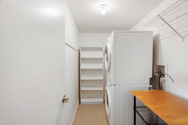 2221 SW 1st Ave Unit 1622, Portland, OR 97201 - laundry area with estacked washer and dryer and baseboards