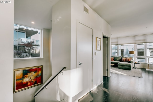 1930 S River Dr Unit W107, Portland, OR 97201 - corridor featuring an upstairs landing, visible vents, and wood finished floors