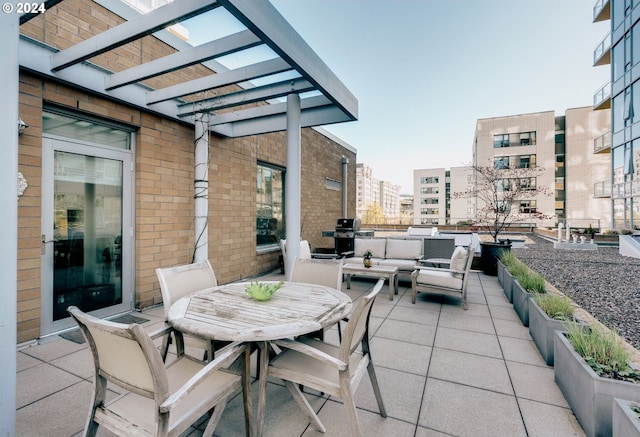 1930 S River Dr Unit W107, Portland, OR 97201 - view of patio / terrace with outdoor dining space, an outdoor hangout area, a pergola, and grilling area