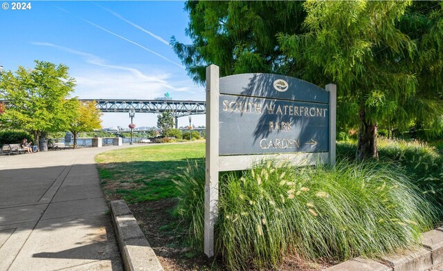 community sign featuring a yard