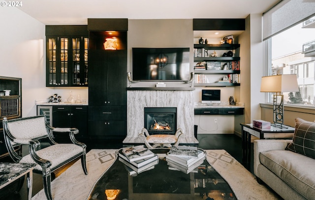 1930 S River Dr Unit W107, Portland, OR 97201 - living room featuring a glass covered fireplace, a dry bar, and dark wood-style floors