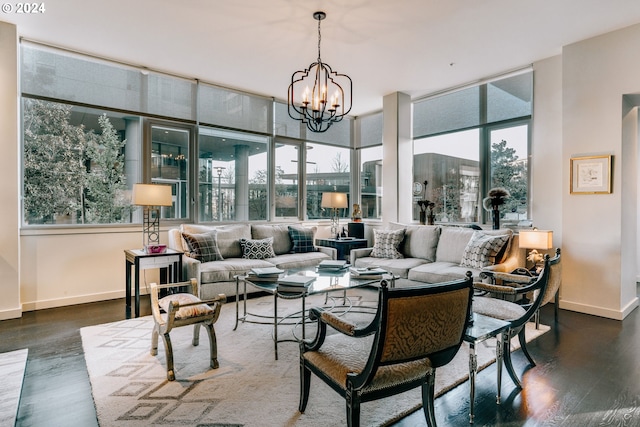 living room featuring floor to ceiling windows, plenty of natural light, a chandelier, and dark wood-type flooring