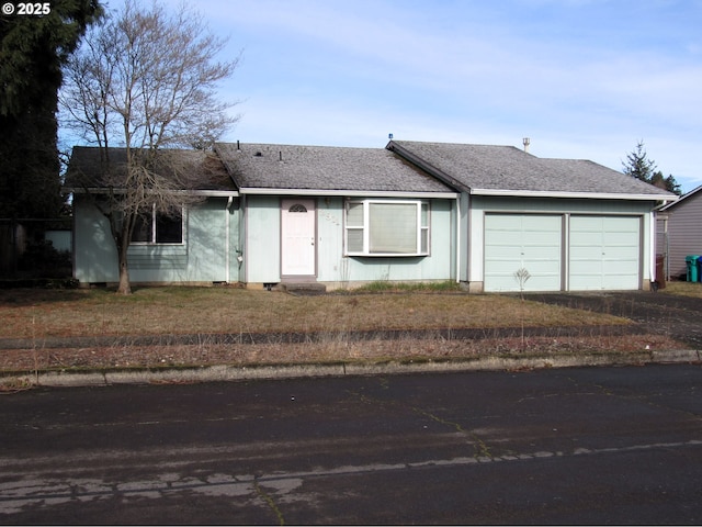 ranch-style house featuring a garage