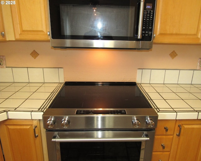 kitchen featuring backsplash and stainless steel appliances