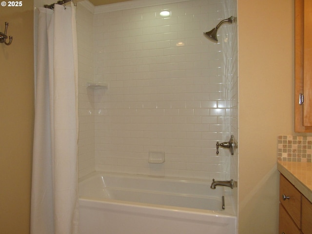 bathroom featuring vanity, decorative backsplash, and shower / bath combination with curtain