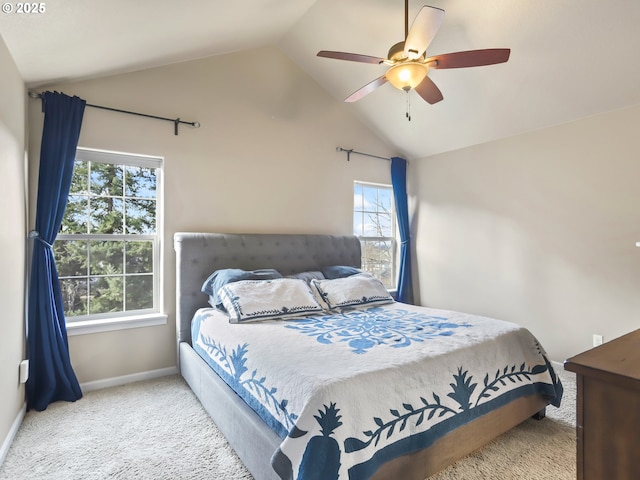 bedroom featuring vaulted ceiling, ceiling fan, baseboards, and light colored carpet