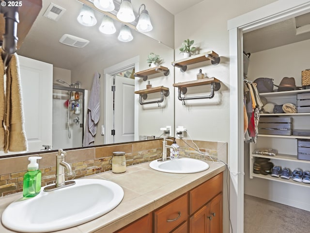 bathroom featuring walk in shower, vanity, and decorative backsplash