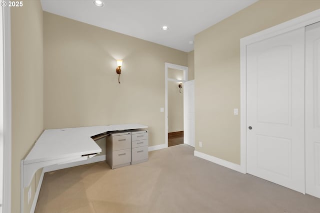 unfurnished office with baseboards, light carpet, and recessed lighting
