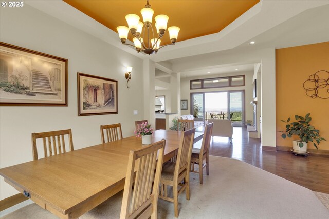 dining area featuring recessed lighting, baseboards, a chandelier, and wood finished floors