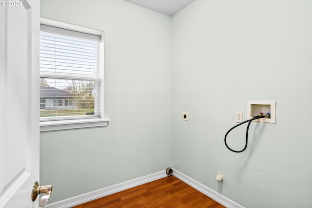 washroom with hookup for an electric dryer, hookup for a washing machine, a healthy amount of sunlight, and wood-type flooring