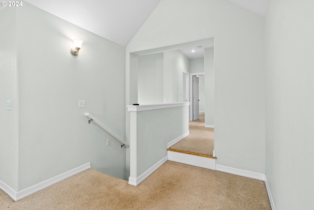 interior space featuring carpet floors and lofted ceiling