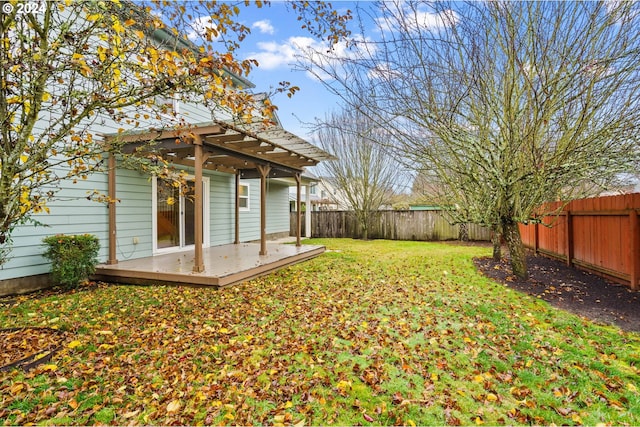 view of yard featuring a deck and a pergola