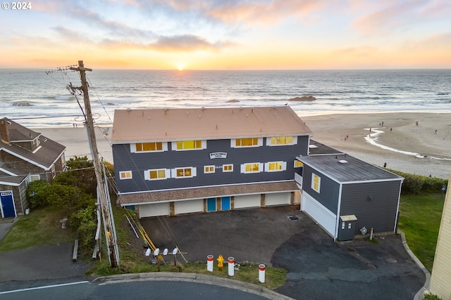 birds eye view of property featuring a view of the beach and a water view