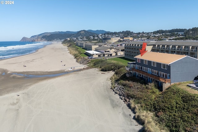 aerial view featuring a view of the beach and a water view