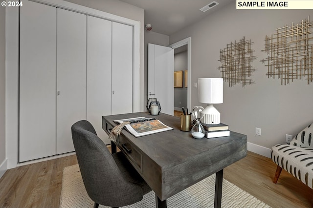 office space with light wood-type flooring