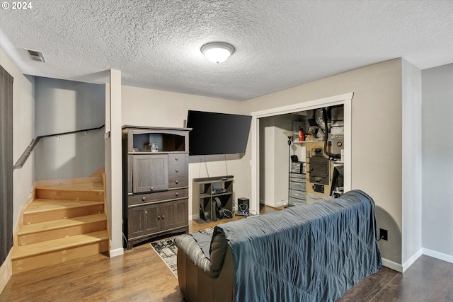 11635 NW Seavey Rd, Forest Grove, OR 97116 - living area featuring wood finished floors, a textured ceiling, baseboards, and stairway