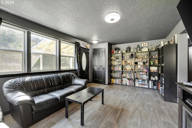 11635 NW Seavey Rd, Forest Grove, OR 97116 - living area with a textured ceiling, wood finished floors, and healthy amount of natural light