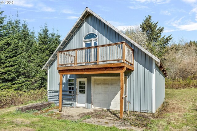 11635 NW Seavey Rd, Forest Grove, OR 97116 - rear view of property featuring a deck, a garage, and board and batten siding