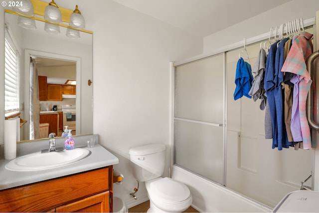 full bathroom with vanity, toilet, and enclosed tub / shower combo