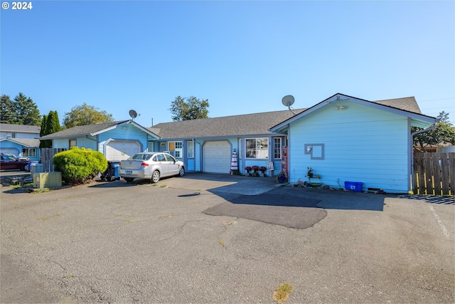 single story home featuring a garage