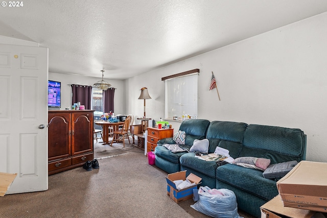 carpeted living room featuring a textured ceiling