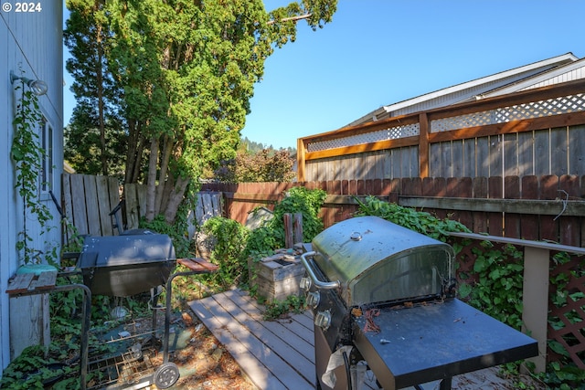 wooden deck with area for grilling