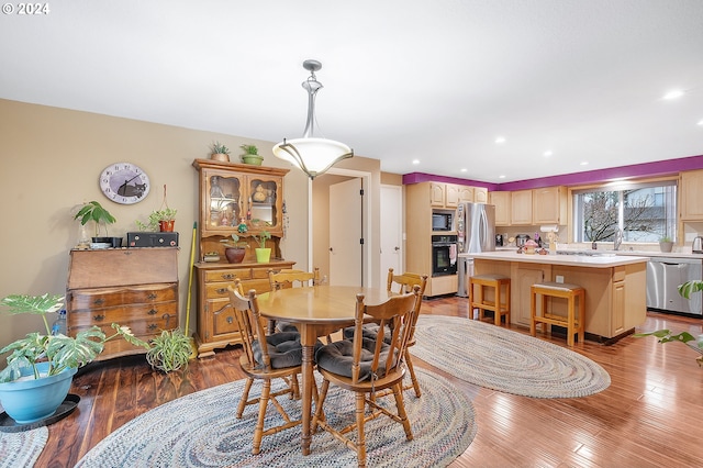 dining room with wood-type flooring