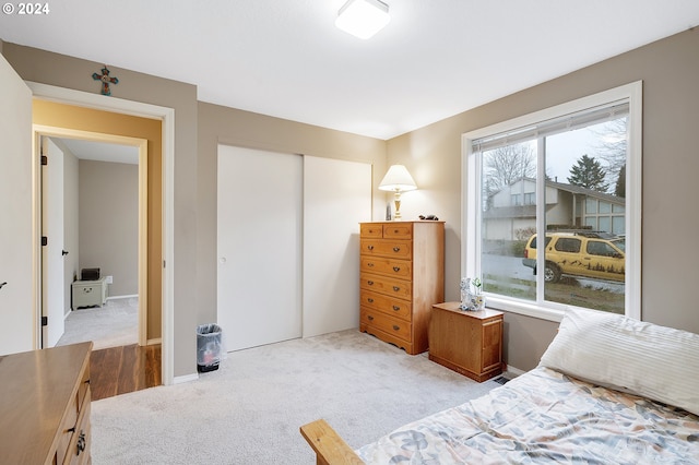 carpeted bedroom featuring a closet