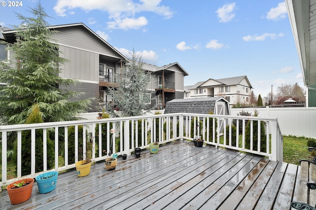 wooden terrace with a shed