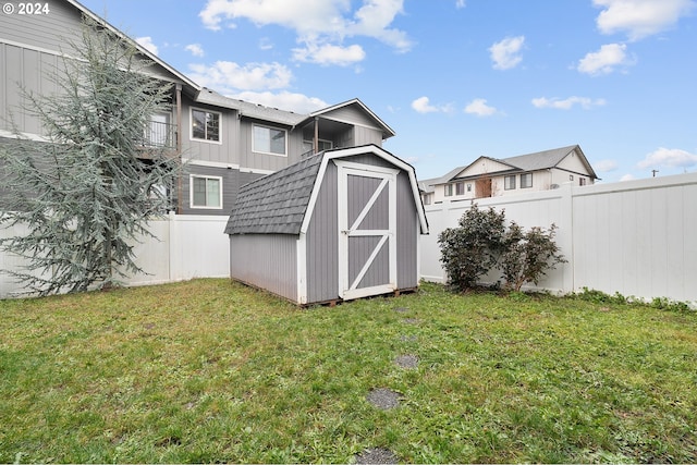 view of outbuilding with a lawn