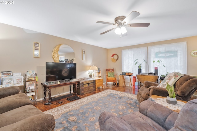 living room featuring hardwood / wood-style flooring and ceiling fan