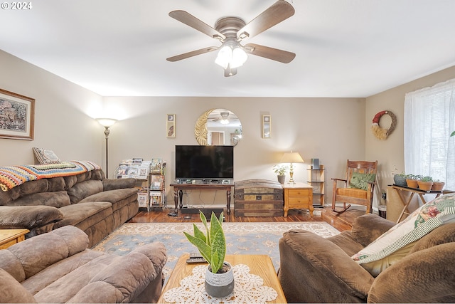 living room featuring ceiling fan and light hardwood / wood-style flooring