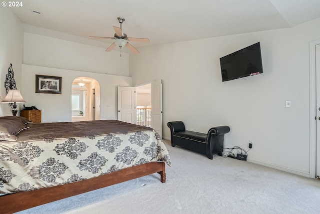 bedroom featuring light colored carpet and ceiling fan