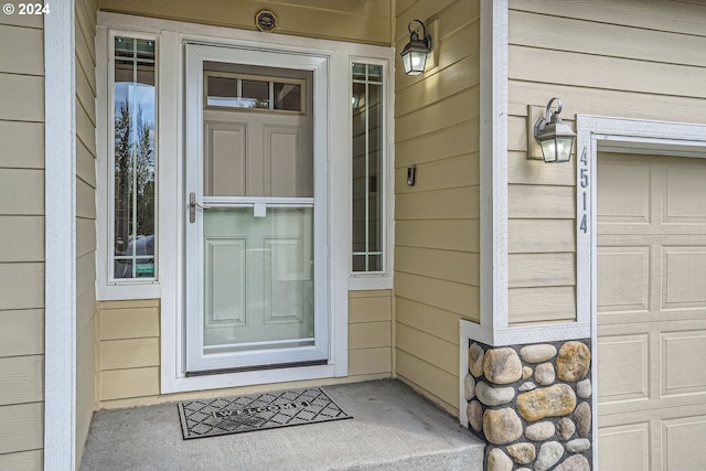 doorway to property featuring a garage