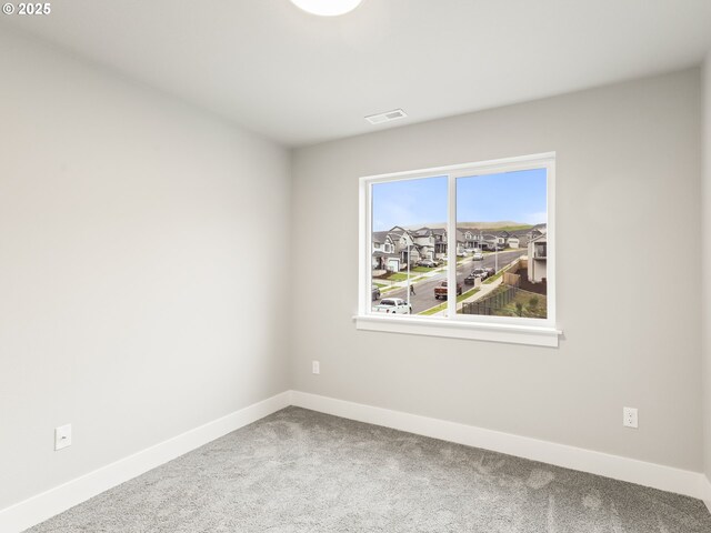 unfurnished room with carpet floors