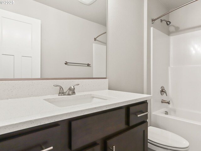 full bathroom with shower / washtub combination, vanity, and toilet