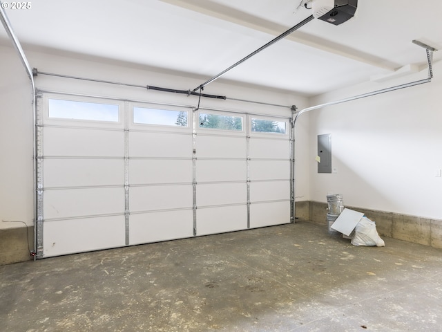 garage featuring electric panel and a garage door opener