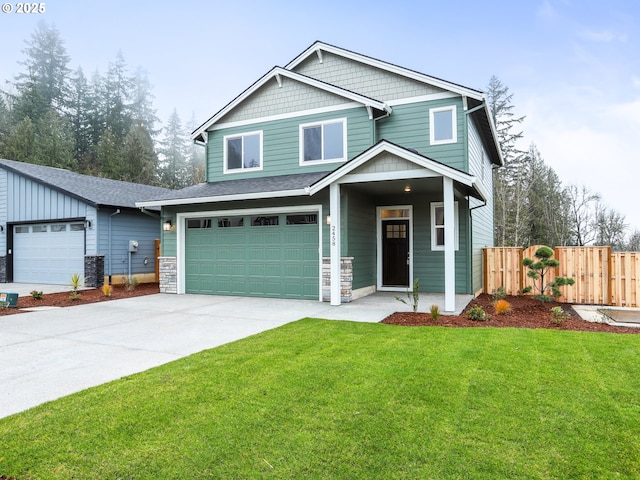 craftsman house with cooling unit, a front lawn, and a garage