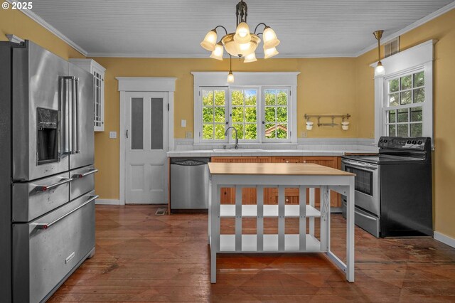 interior space with wood-type flooring, crown molding, visible vents, and an inviting chandelier