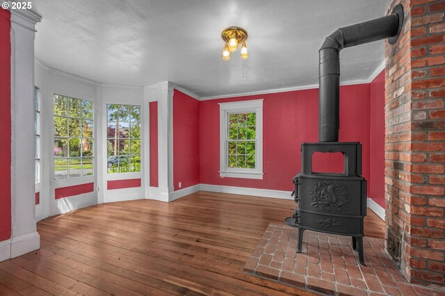 spare room featuring visible vents, baseboards, and hardwood / wood-style floors