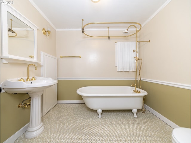 bathroom featuring toilet, tile patterned flooring, crown molding, and a tub to relax in