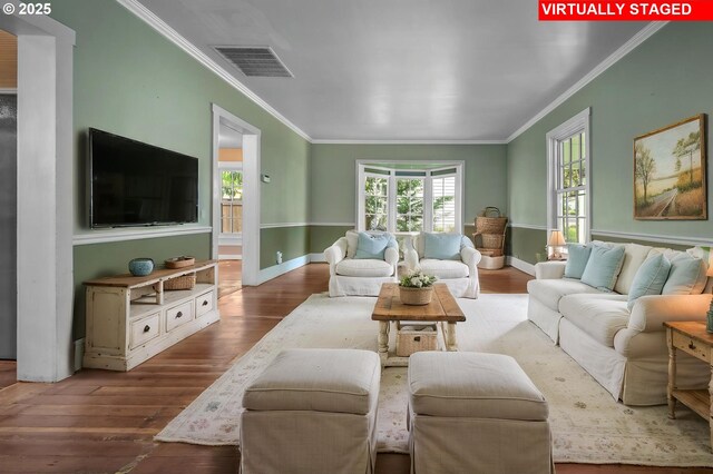 unfurnished living room with crown molding, baseboards, and a wood stove