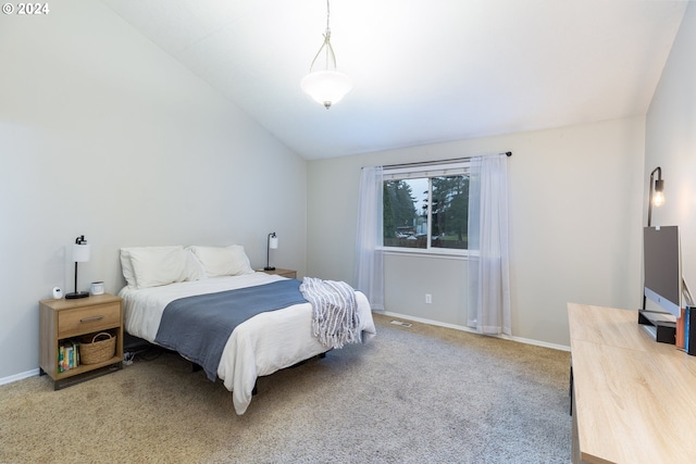 bedroom featuring lofted ceiling, carpet flooring, visible vents, and baseboards