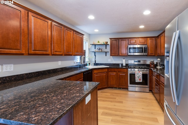 kitchen with open shelves, stainless steel appliances, recessed lighting, a sink, and light wood-type flooring