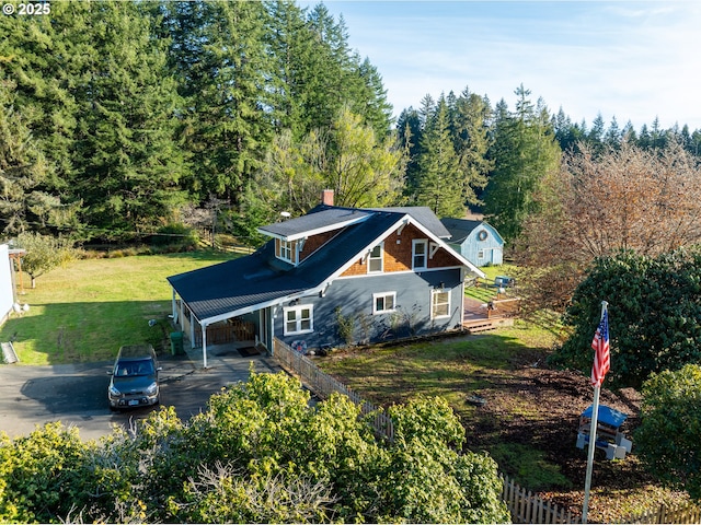 61007 Old Wagon Rd, Coos Bay, OR 97420 - view of front of property with a front lawn, a chimney, a forest view, a carport, and aphalt driveway