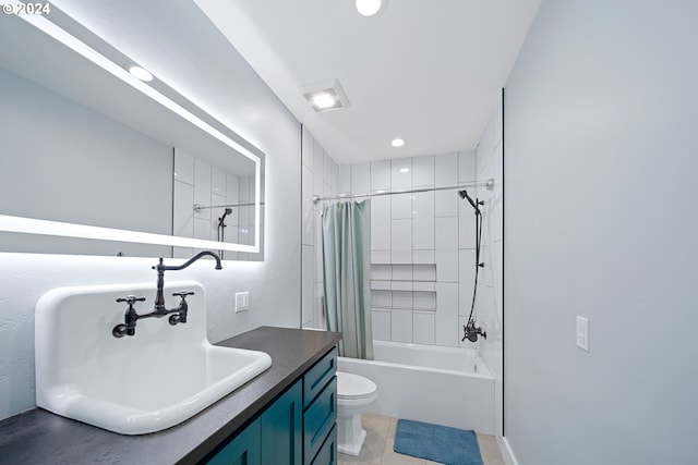 full bathroom featuring tile patterned floors, shower / bath combo, toilet, and vanity