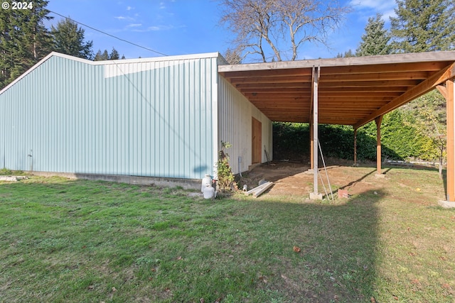 view of outbuilding featuring a lawn