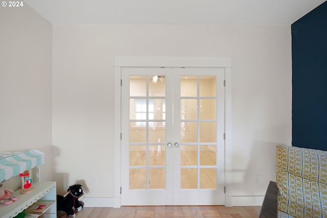 doorway to outside with french doors and light hardwood / wood-style floors