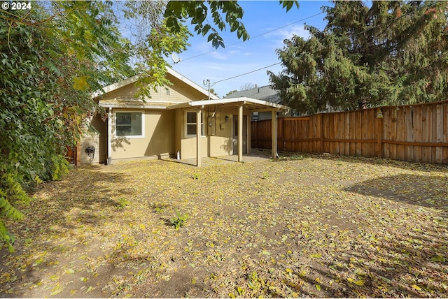 back of house with a patio area