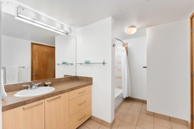 bathroom featuring shower / bath combination with curtain, vanity, and tile patterned floors